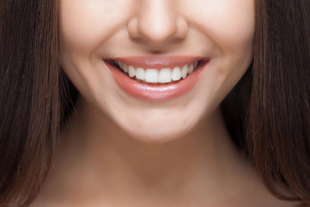 person with straight white teeth